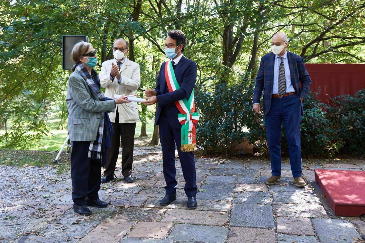 Giancarla Tagliabue collects the parchment for Carlo Tagliabue